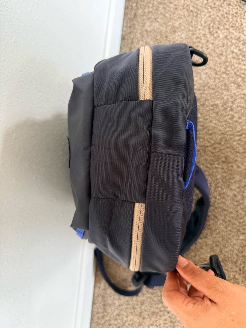 cotopaxi Black Sling Backpack with Blue Piping and Red Zip Pull - Picture 7 of 10